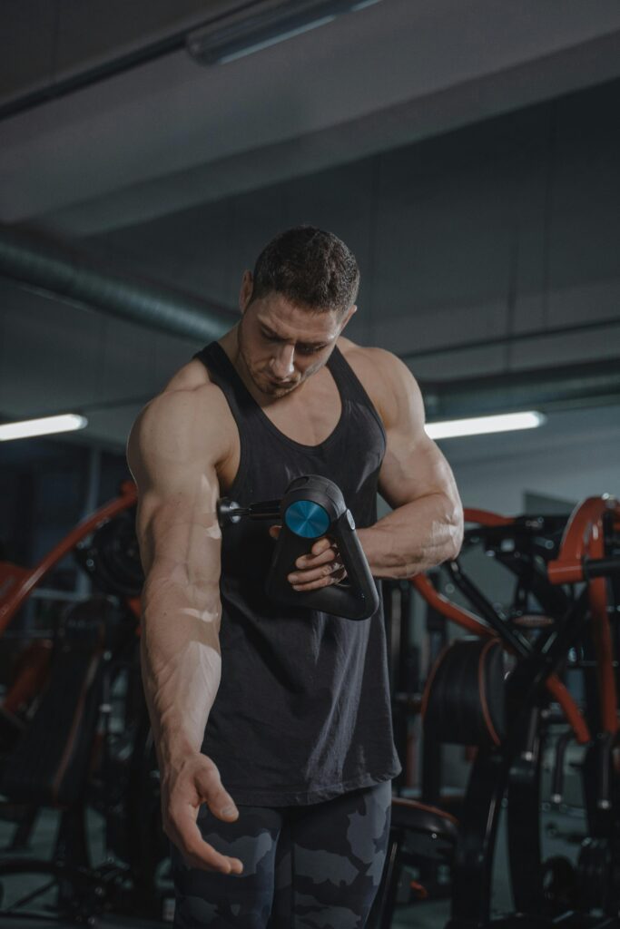 A Bodybuilder Massaging His Muscles